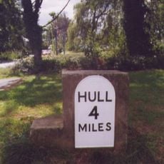 Milestone, At W end of Bilton, beside roundabout leading to Asda supermarket.