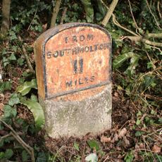Milestone, Hill village, opp. Springfields
