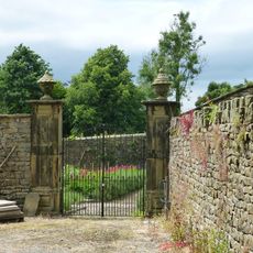 Pair of gatepiers in Downham Hall garden, approximately 60 metres north west of school
