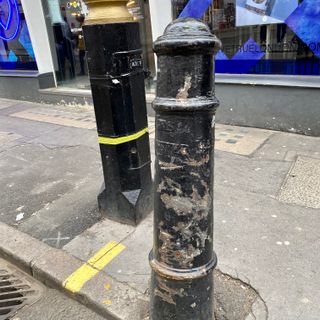 2 Bollards At Junction With D'Arblay Street