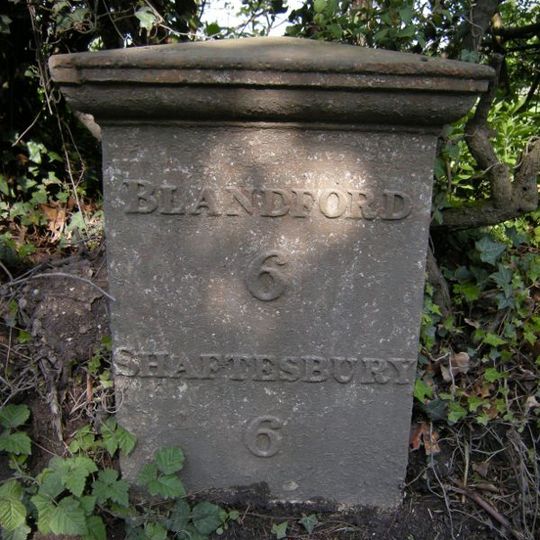 Milepost, S of village, 50m S of 30mph signs