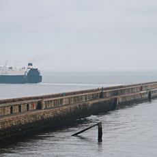 North Pier With Crane Attached And Lighthouse
