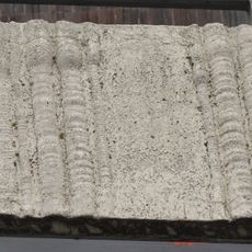 Concrete relief on the railing of the Dornych shopping center