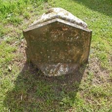 Milestone On West Side Of Village