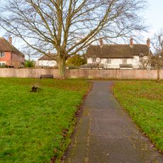 White Cottage And Attached Garden Wall And Stable