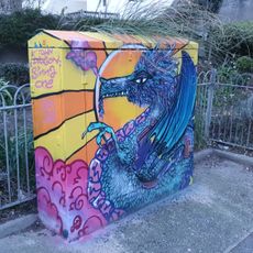A colourful dragon painted on a street cabinet