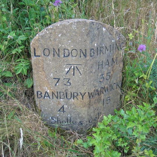 Milestone, rear northern village turn