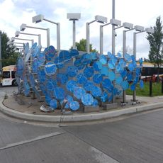 Artwork portrays deconstructed street map of Baltimore. Forms series of panels around bus operator restrooms.