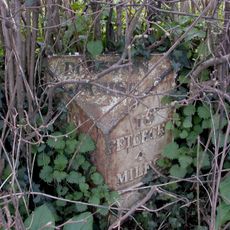Milepost, below Asper Wood
