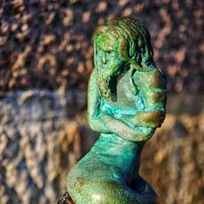 A tiny sculpture of a merman