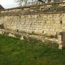 Wall Incorporating Stone Seat Forming The Northern Boundary To The Churchyard Of The Church Of St Mary