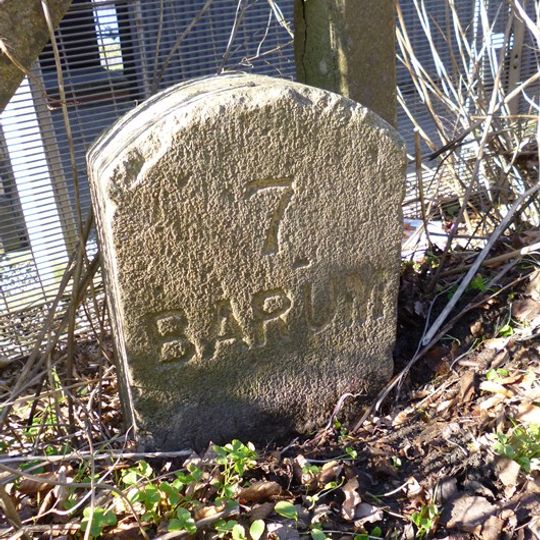 Milestone, by Zeta Berth fuel depot, 200m E of Tapeley Park Garden entrance