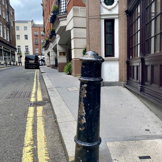 Bollard On Corner With Brick Street