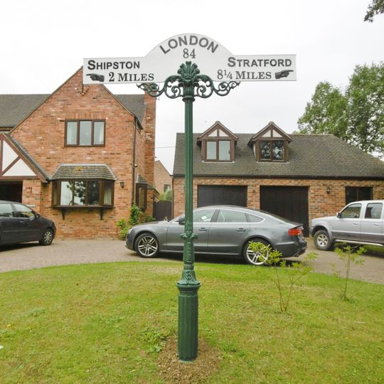 Milepost, Stratford Road, N of Post Office, by "Hillcrest" 17m W of The Lodge