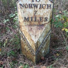 Milepost, 10m N of double metal farm gate into field