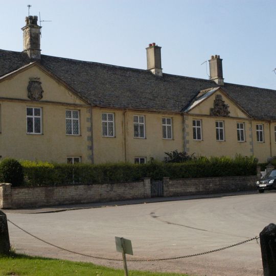 The Almshouse And Former School And Boundary Walls And Gate Piers To The Road
